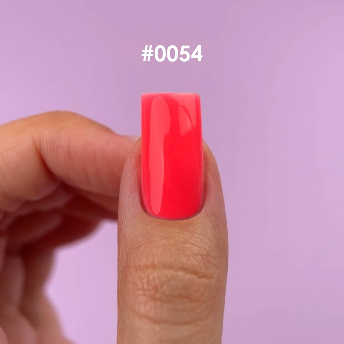 Coral-pink tone of DNKa Builder Gel #0054 Dopamine swatched on nails