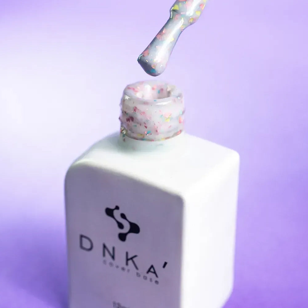 Close-up swatch showing the multicolor glitter in DNKa Cover Base #0011A Happy