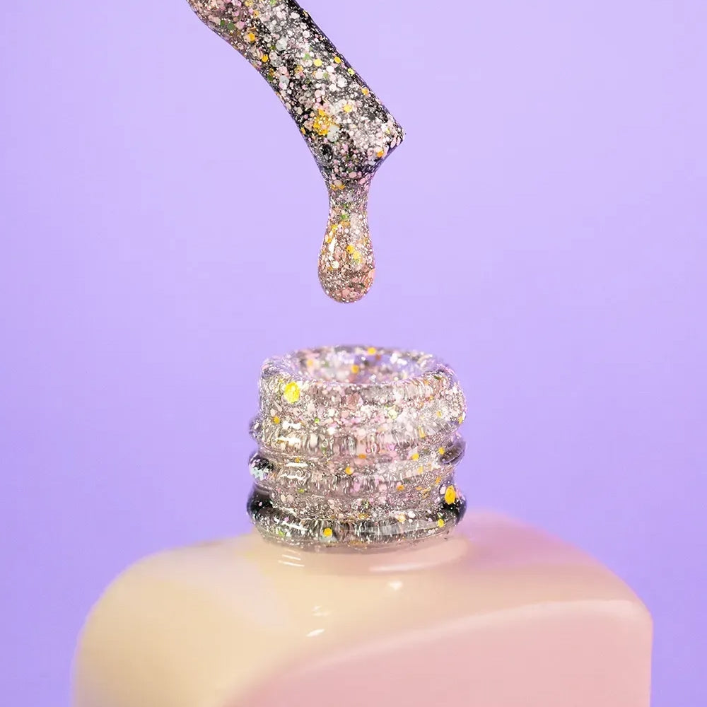 DNKa Cover Base #0052 Meteoric bottle next to DNKa top coat