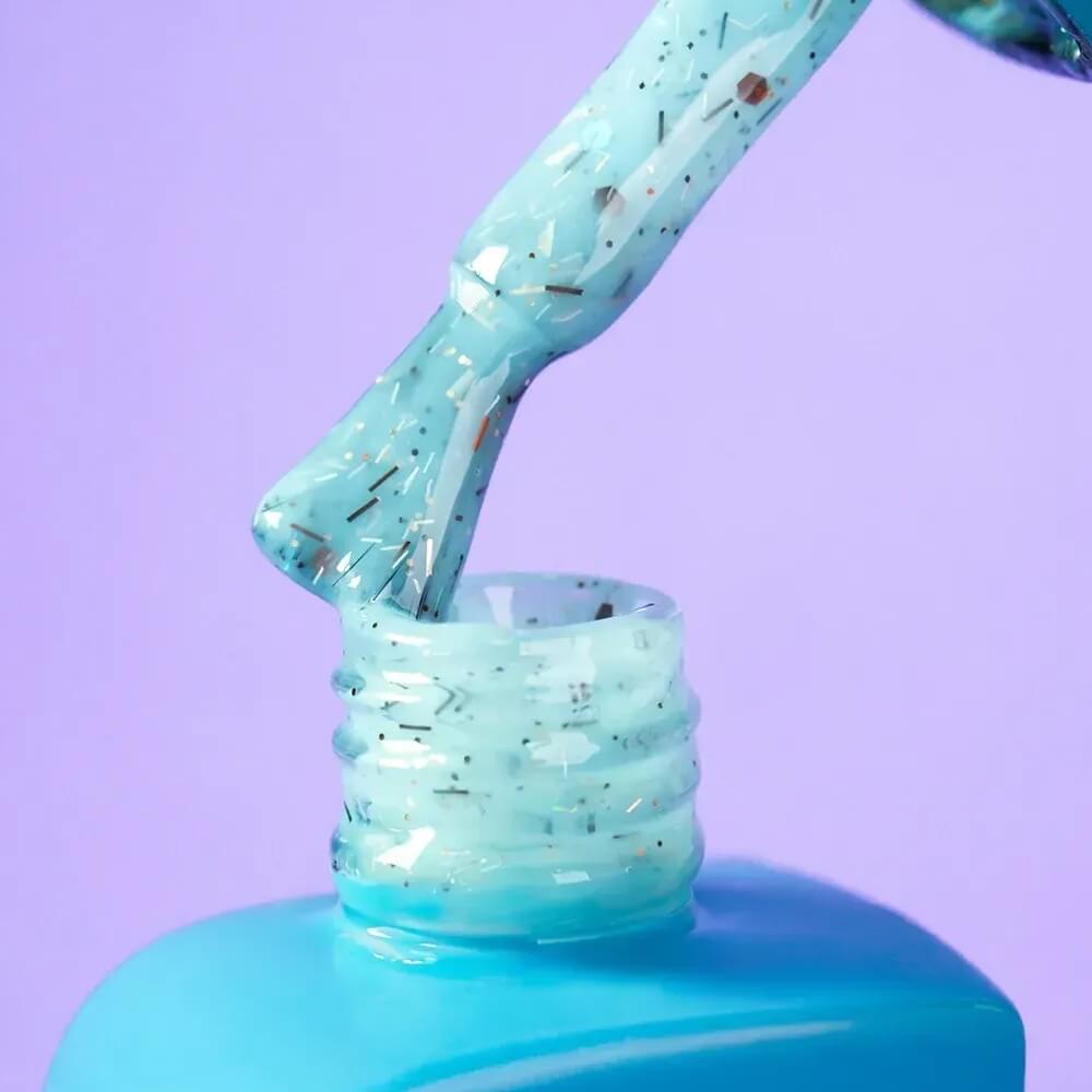 Close-up swatch of the 30ml Awesome shade, showing its celeste blue tone and decorated fleck texture