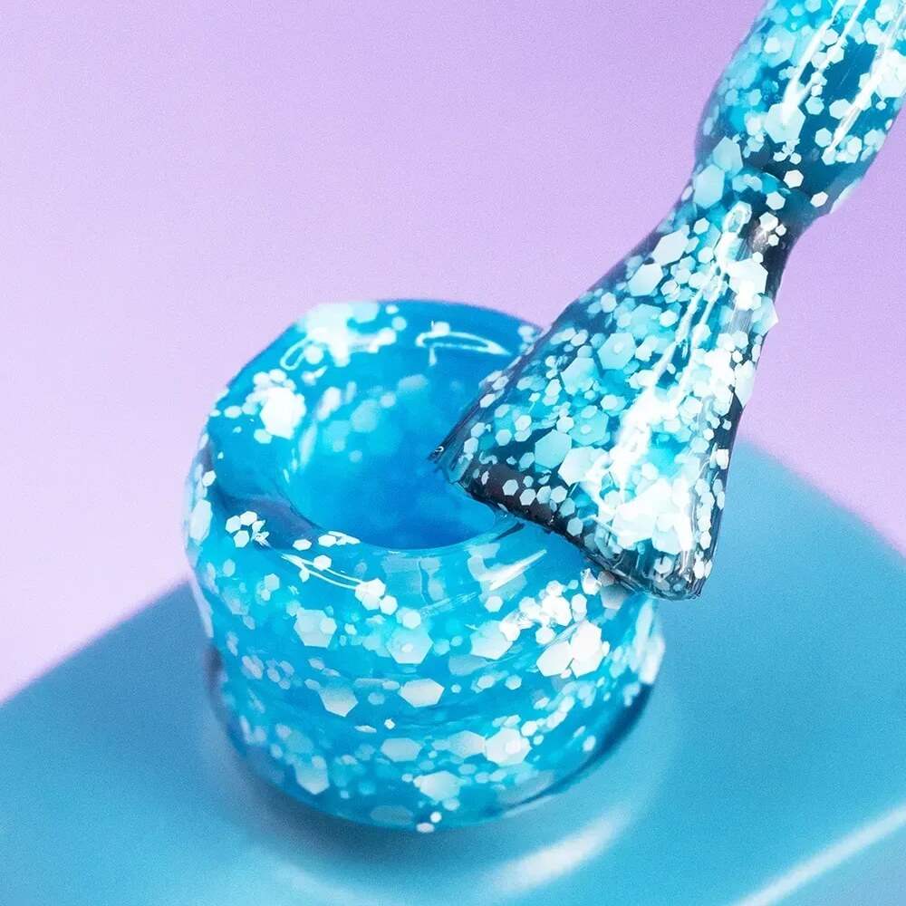Freshly cured nails coated in 12ml Breeze, showing the sheer neon blue finish