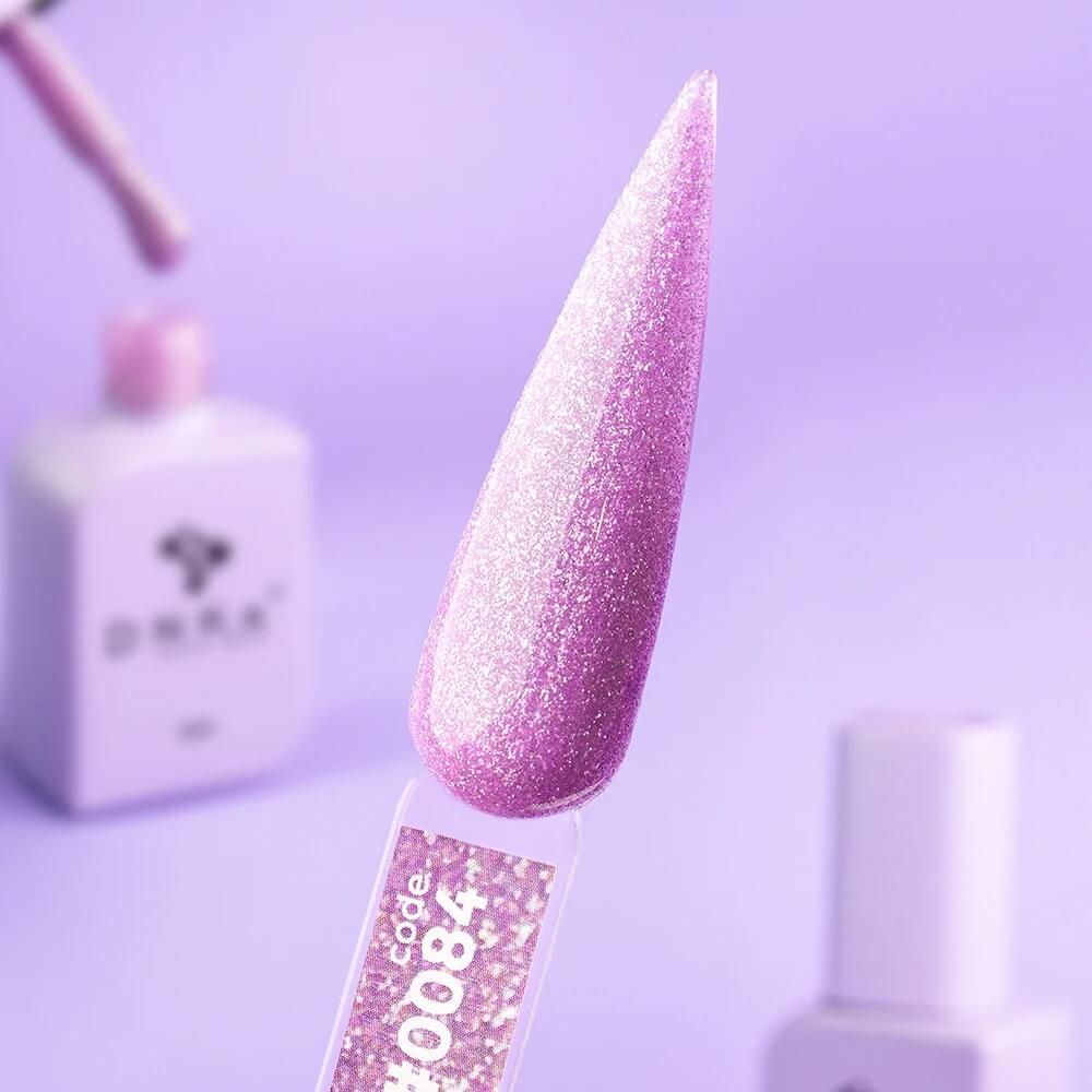 12ml — DNKa Cover Base #0084 Euphoria — swatch on nail tip, dark purple glitter camouflage base
