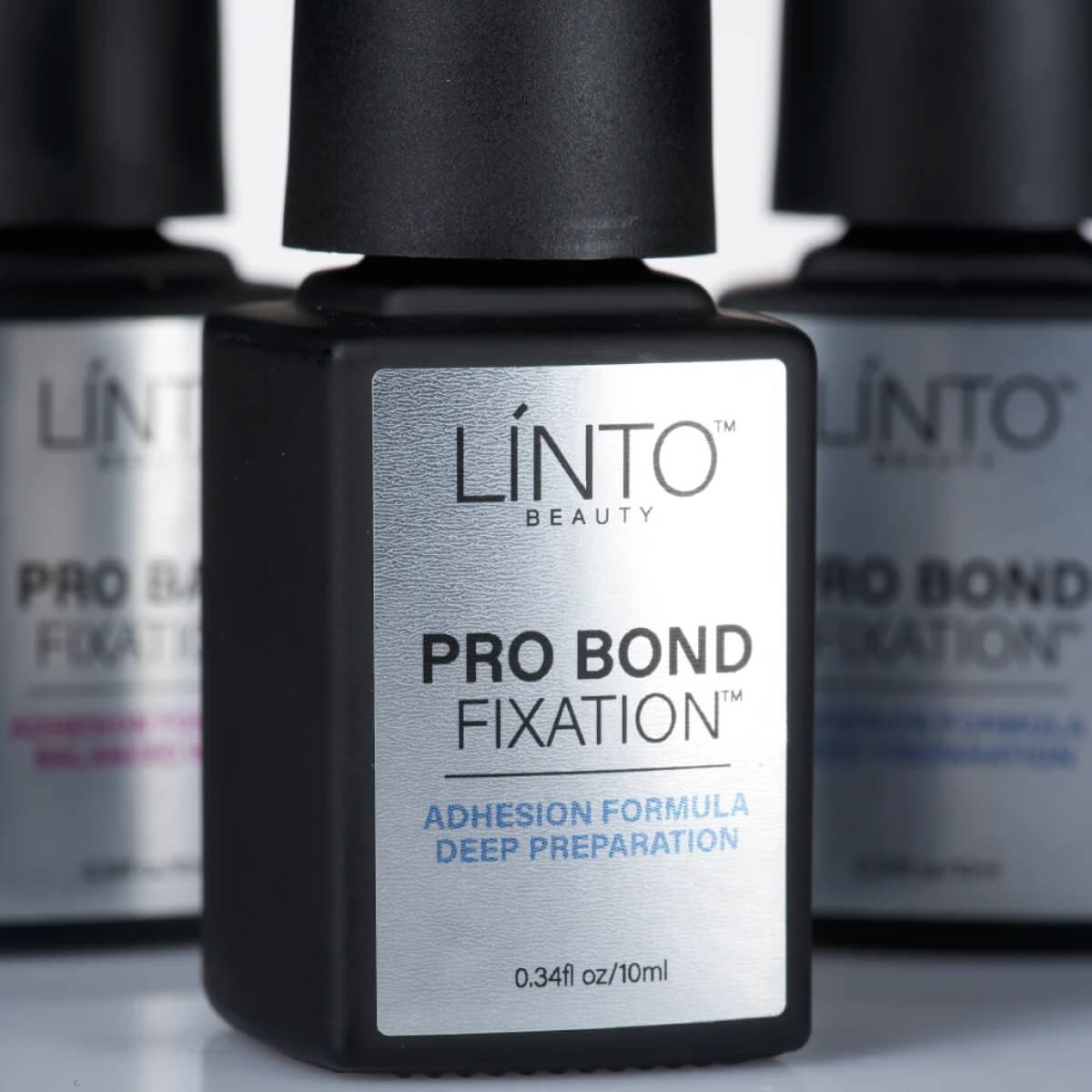 LiNTO Pro Bond Fixation being applied in a thin layer on the nail