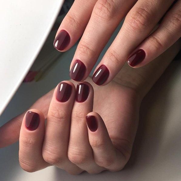 Luxio Diva Gel Polish — swatch on nail tip, deep plum finish