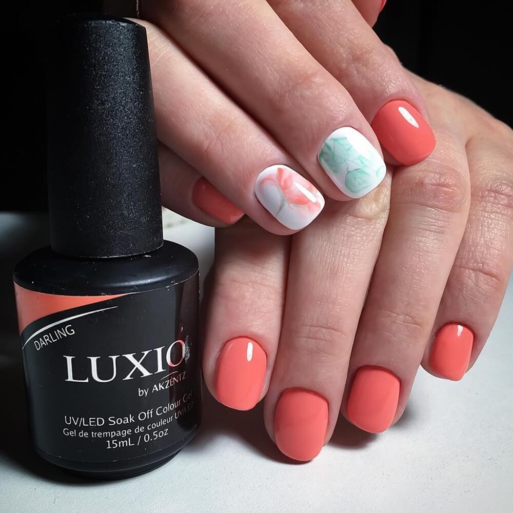 Luxio Darling Gel Polish, 15ml, coral swatch on nail tip