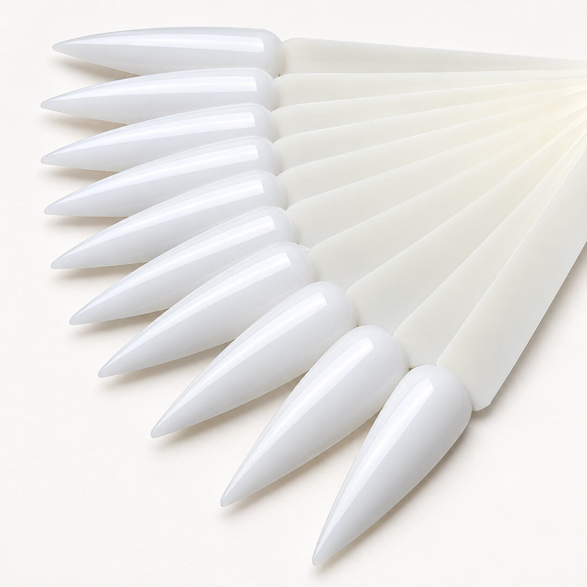 Long stiletto tips displaying a gel polish color palette