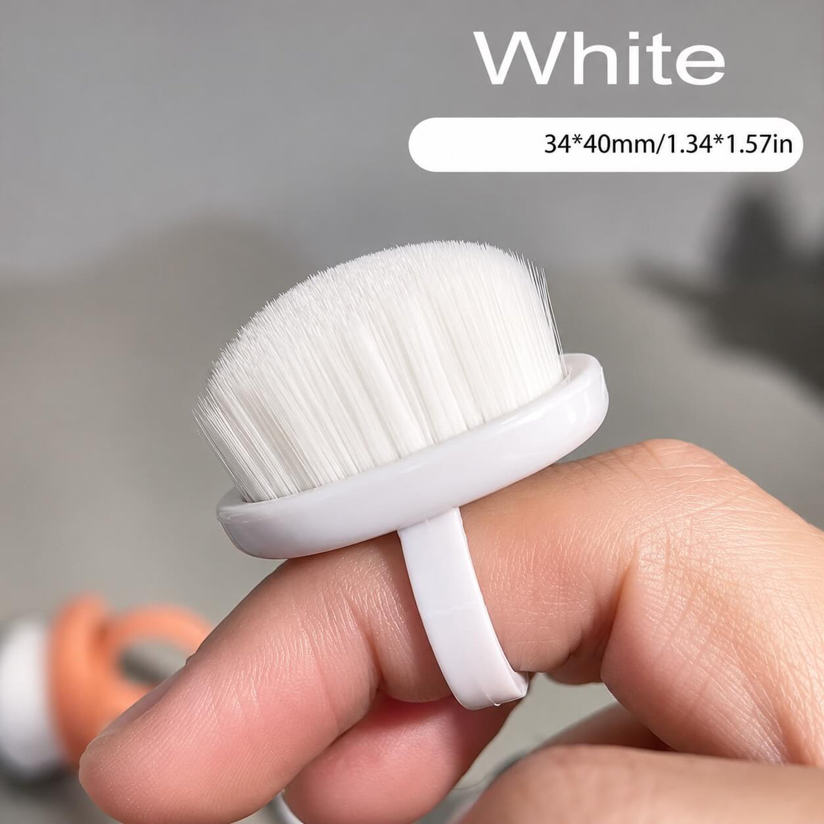 Black ring dust brush with tan bristles next to a white ring dust brush