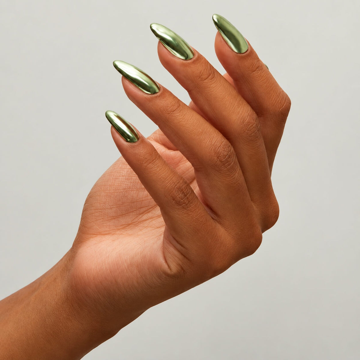 Reflective green chrome pigment for nail art by The GelBottle