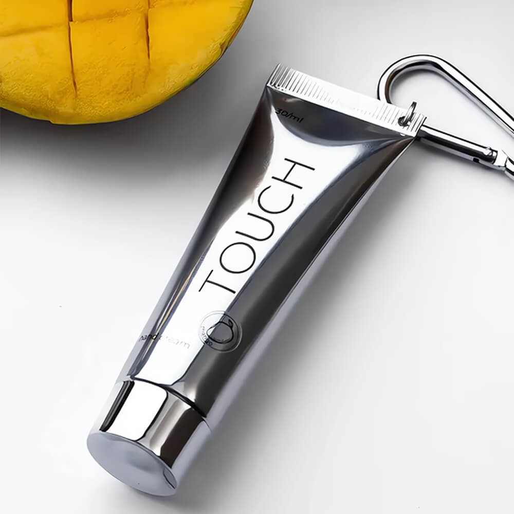 30ml — TOUCH Silver Line Hand Cream Mango — being applied to hands