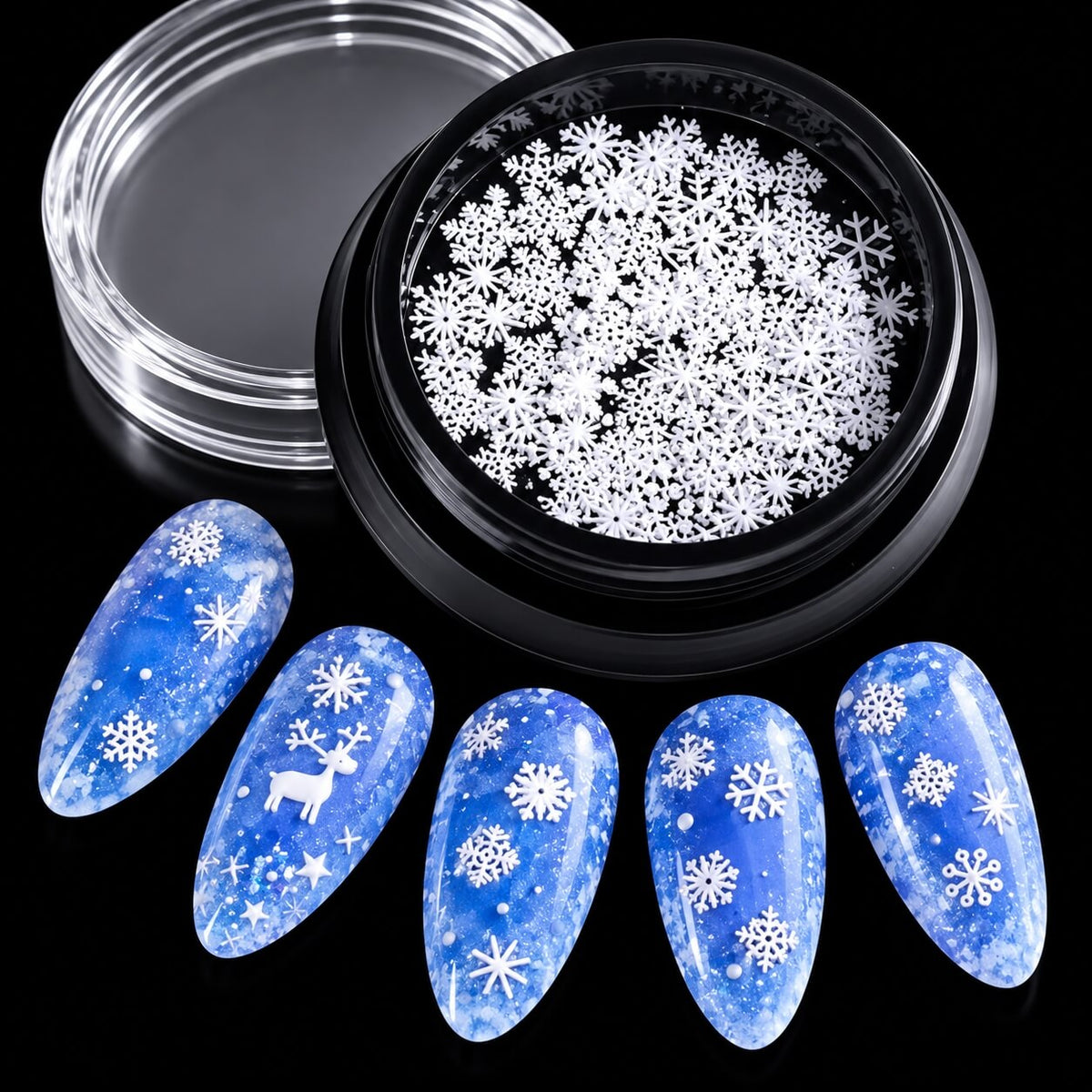White dimensional snowflake nail embellishments in multiple sizes for festive manicures