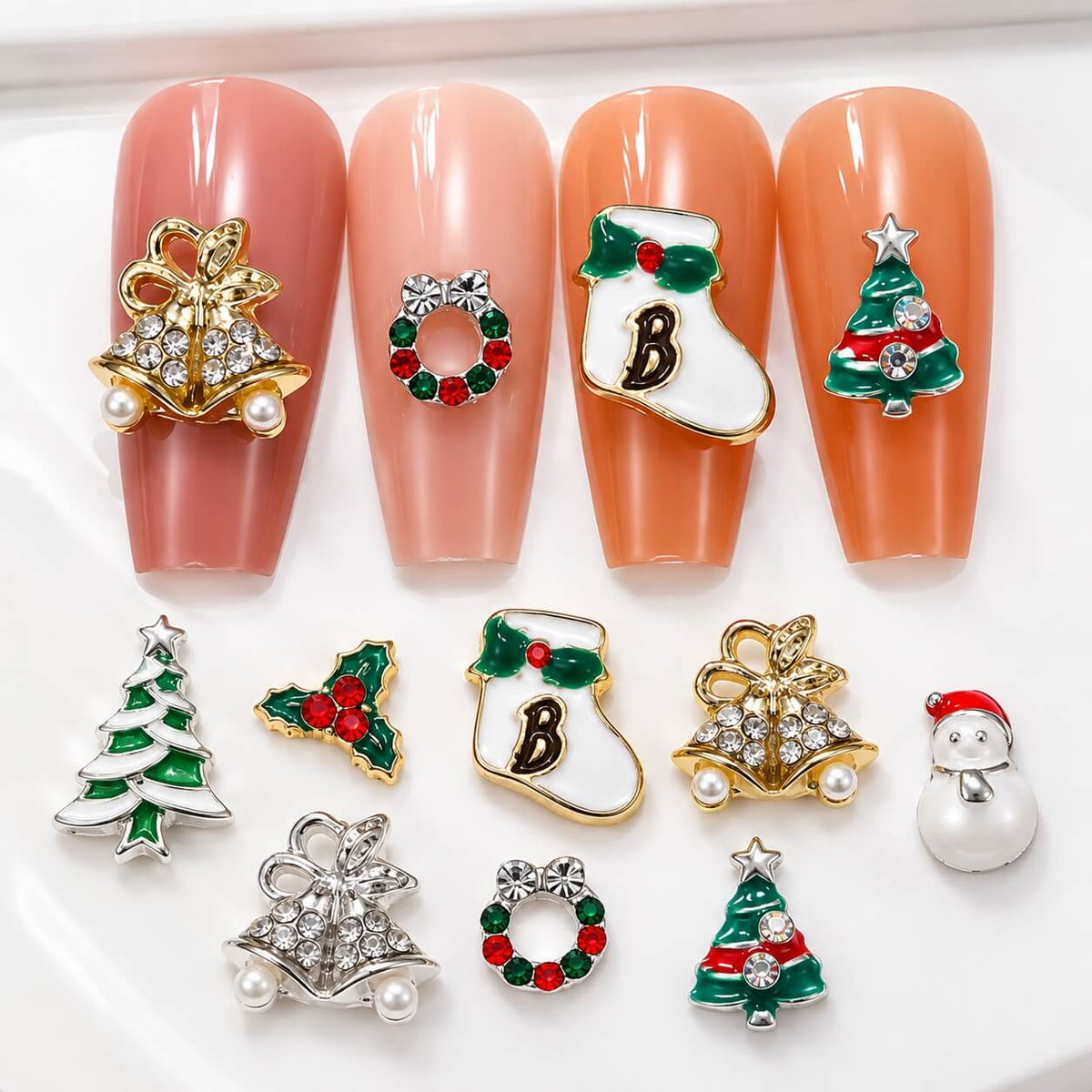 Holiday 3D nail decorations with colorful enamel-style details and sparkling rhinestones