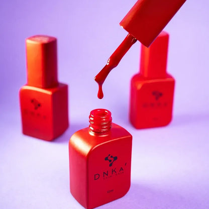 Side angle of the DNKa Cover Base #0003 Passionate bottle showing the label