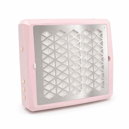 Pink aluminum cordless nail dust collector on a manicure desk