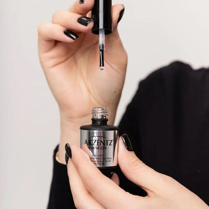 Applying Akzentz Shine-On no-wipe top coat to a nail