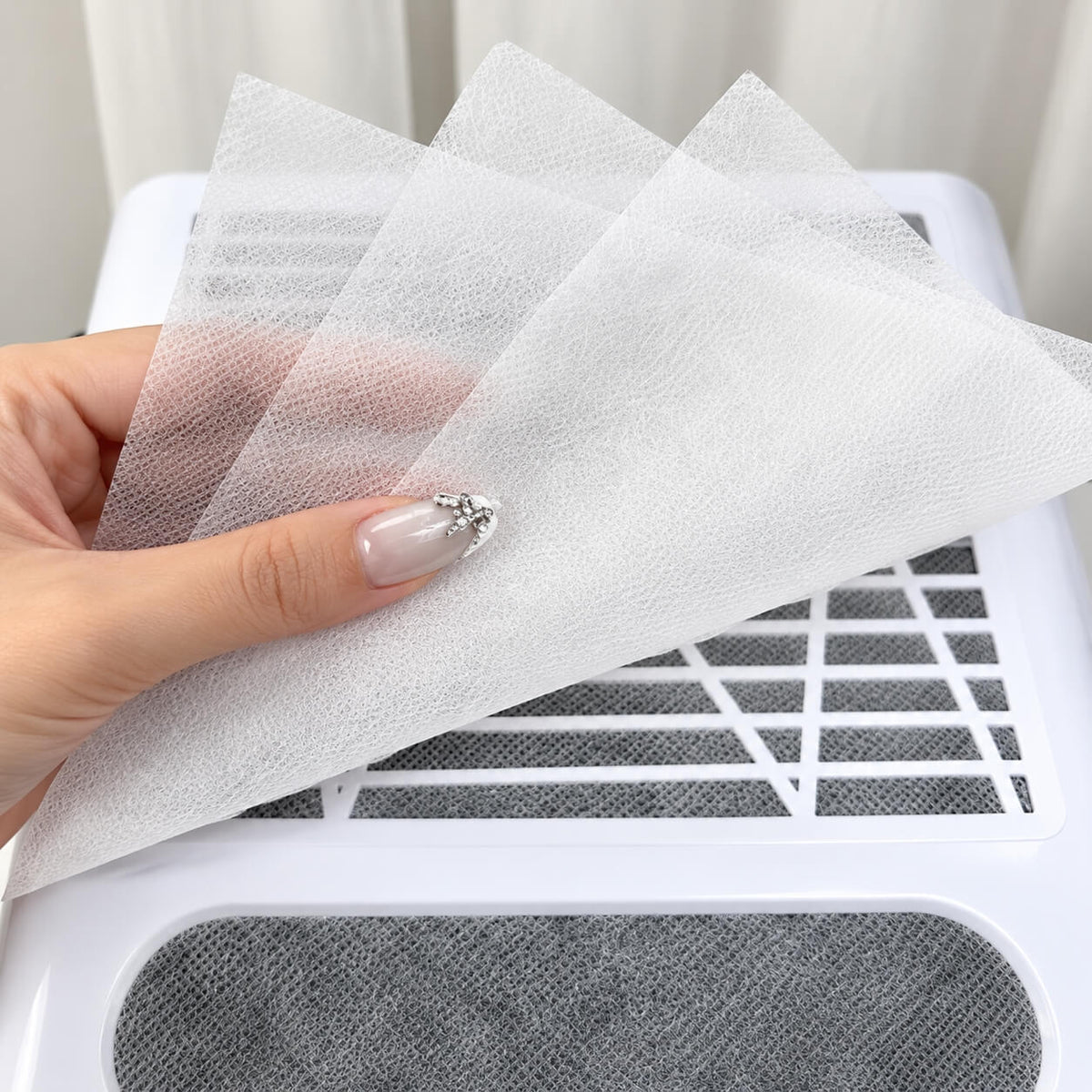Disposable white nail dust collector filter sheets, 100 pcs, 9.25 × 7.48 inches.
