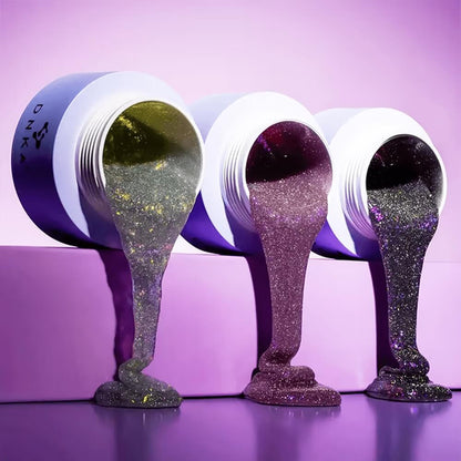 DNKa Builder Gel #0027 Burlesque — open jar with brush, silver glitter gel