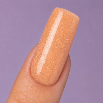 DNKa Builder Gel Hollywood Glow #0031 — swatch on nail tip, reflective beige glitter