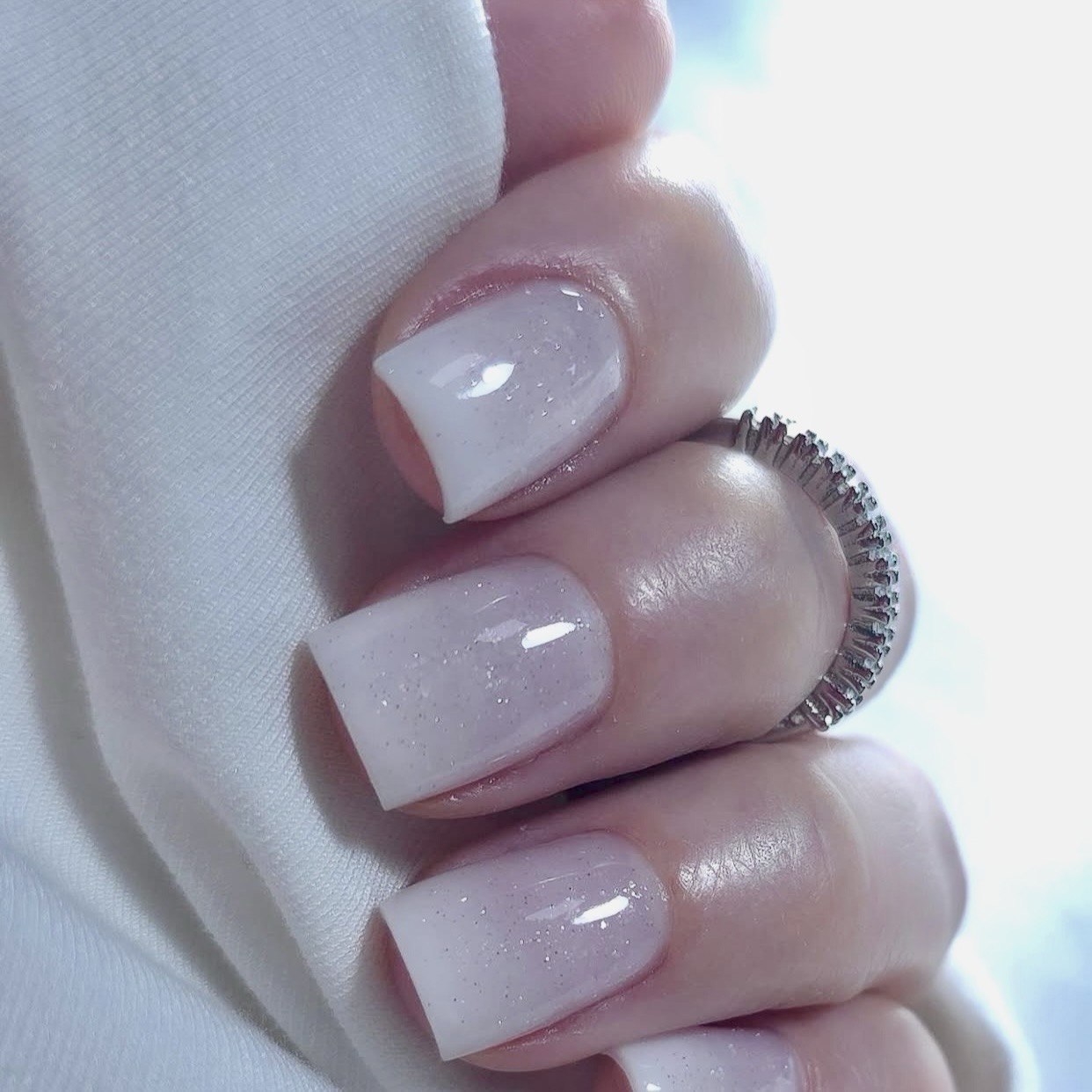 DNKa Builder Gel Hollywood Glow #0034 — single nail close-up, reflective shine detail