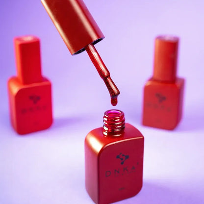 DNKa Cover Base #0005 Daring bottle tilted to catch the light on the glitter