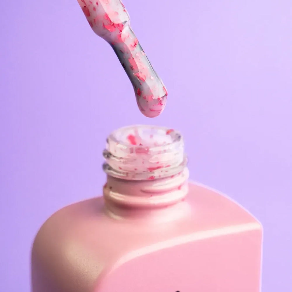 Top view of the DNKa Cover Base #0010A Lovely bottle and brush