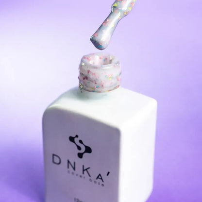 Close-up swatch showing the multicolor glitter in DNKa Cover Base #0011A Happy