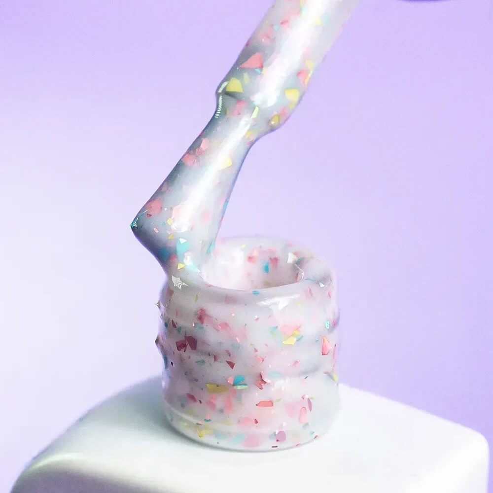 DNKa Cover Base #0011A Happy bottle tilted to catch the light on the glitter