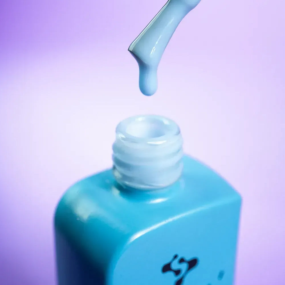 Side angle of the DNKa Cover Base #0016 Sincere bottle and brush applicator