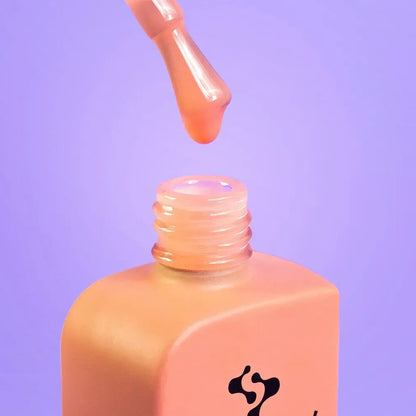 Side angle of the DNKa Cover Base #0017 Kind bottle and brush applicator