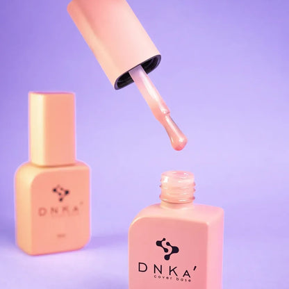 Side angle of the DNKa Cover Base #0018 Dreamy bottle and brush applicator