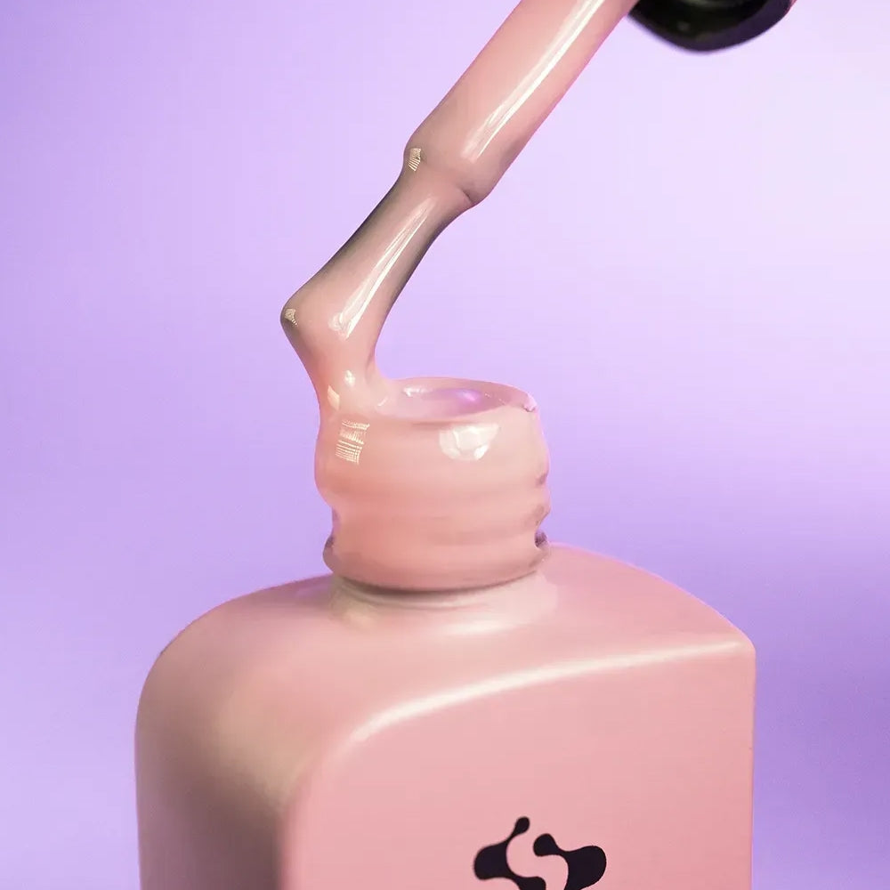 DNKa Cover Base #0034 Modest pink manicure on hand