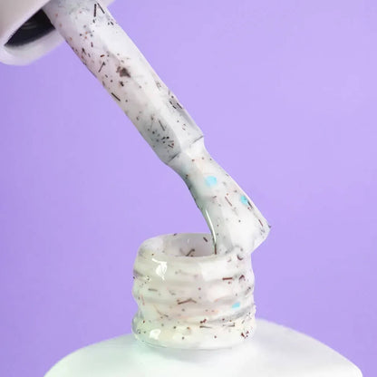 DNKa Cover Base #0054 Sensation confetti manicure on hand
