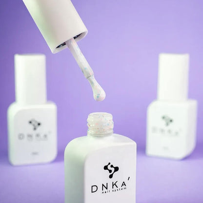 Freshly cured nails coated in 12ml Inspiration, showing the milky base and multicolor glitter