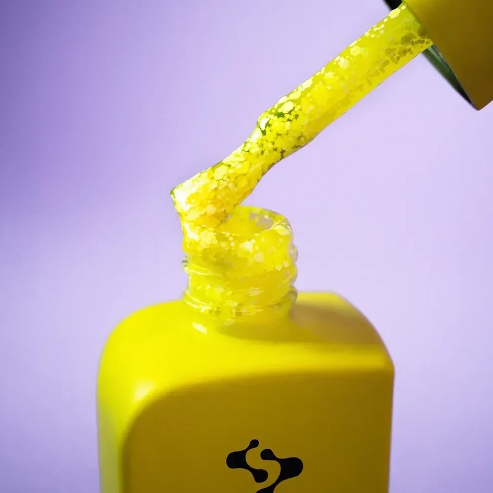 Freshly cured nails coated in 12ml Holiday, showing the sheer neon yellow finish