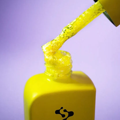 Freshly cured nails coated in 12ml Holiday, showing the sheer neon yellow finish