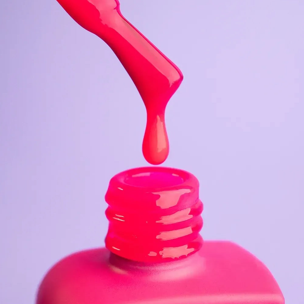 Open 12ml Flamingo bottle with brush against the cap, bright pink gel on the bristles
