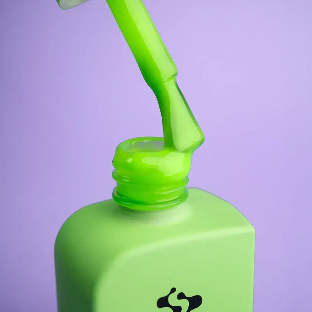 Open 12ml Risky bottle with brush against the cap, neon green gel on the bristles