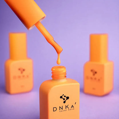 Open 12ml Aperol bottle with brush against the cap, orange gel on the bristles