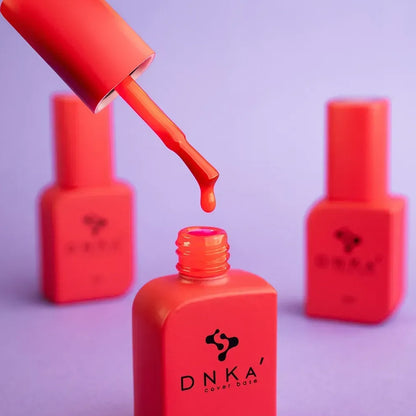 DNKa Cover Base #0077 Campari, 12ml bottle standing closed, bold neon red color