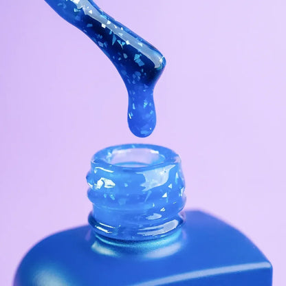 Nails freshly cured in 12ml Azure, vibrant blue shimmer finish