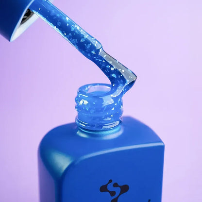 Hand shot of a complete manicure in 12ml Azure, reflective blue across all nails