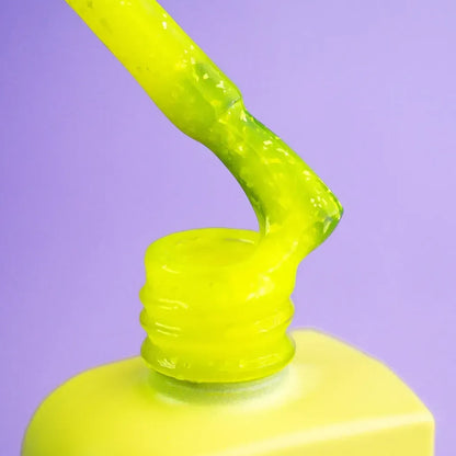 DNKa Cover Base #0079 Joy, 12ml bottle standing closed, yellow with shimmer effect