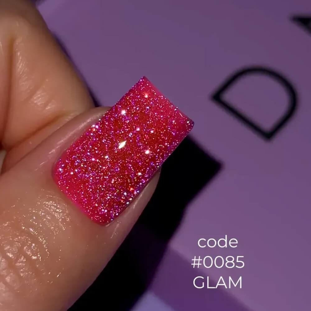 12ml — DNKa Cover Base #0085 Glam — single nail close-up, reflective pink base with fine glitter