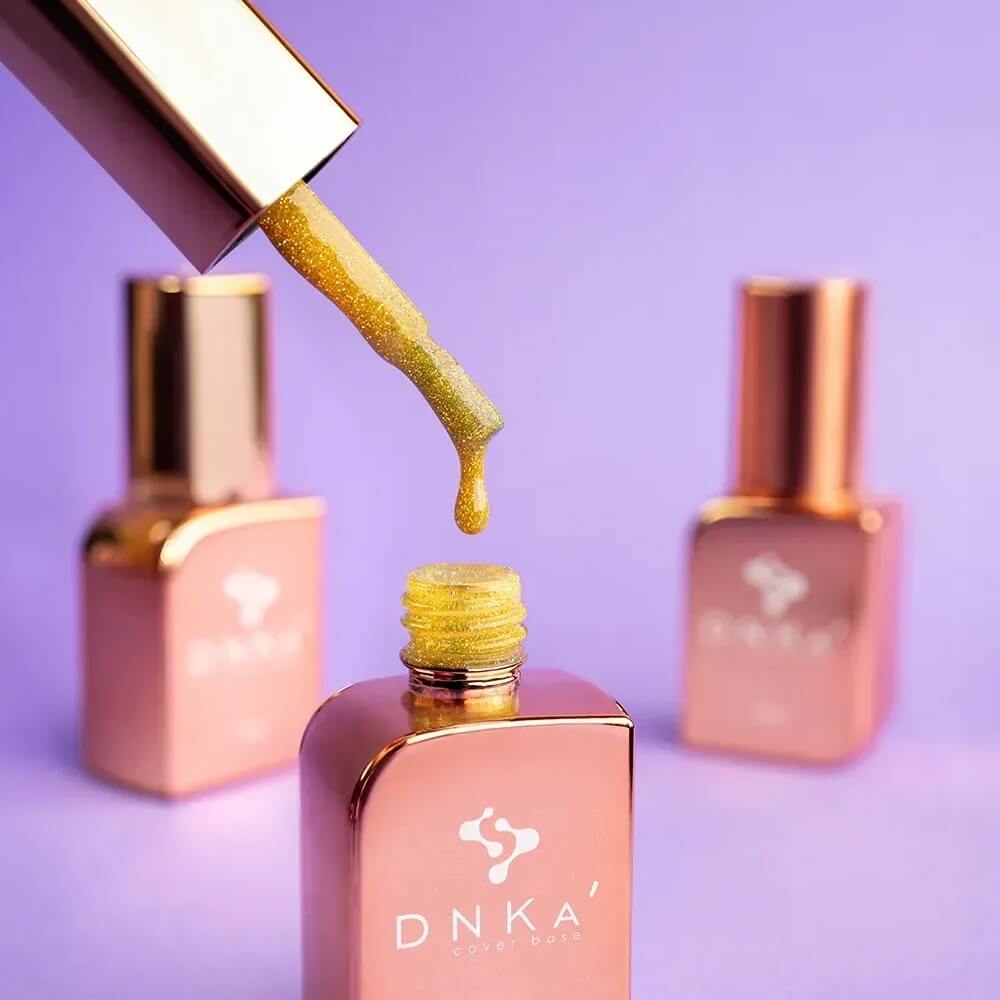 12ml — DNKa Cover Base #0087 Proud — single nail close-up, reflective golden yellow base