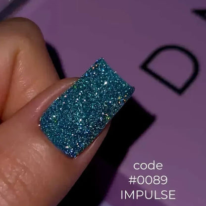DNKa Cover Base #0089 Impuls — swatch on nail tip, reflective turquoise base