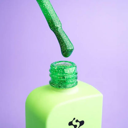 12ml — DNKa Cover Base #0090 Wizard — swatch on nail tip, reflective neon green base