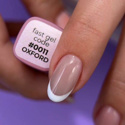 12ml — DNKa Fast Gel #0011 Oxford — swatch on nail tip, translucent lilac finish