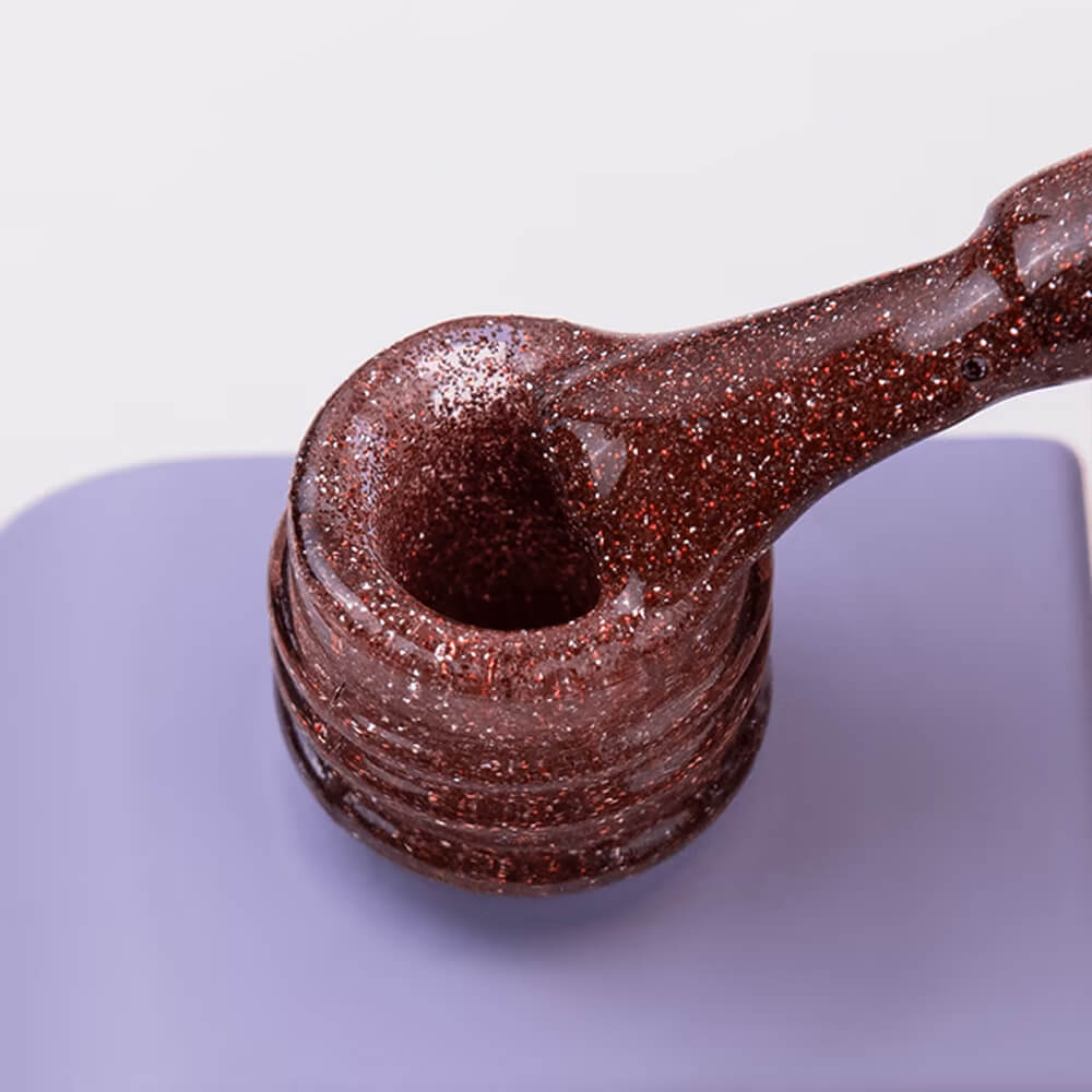 DNKa Gel Polish Color #0142 Autumn Kiss — single nail close-up, flash glitter shimmer