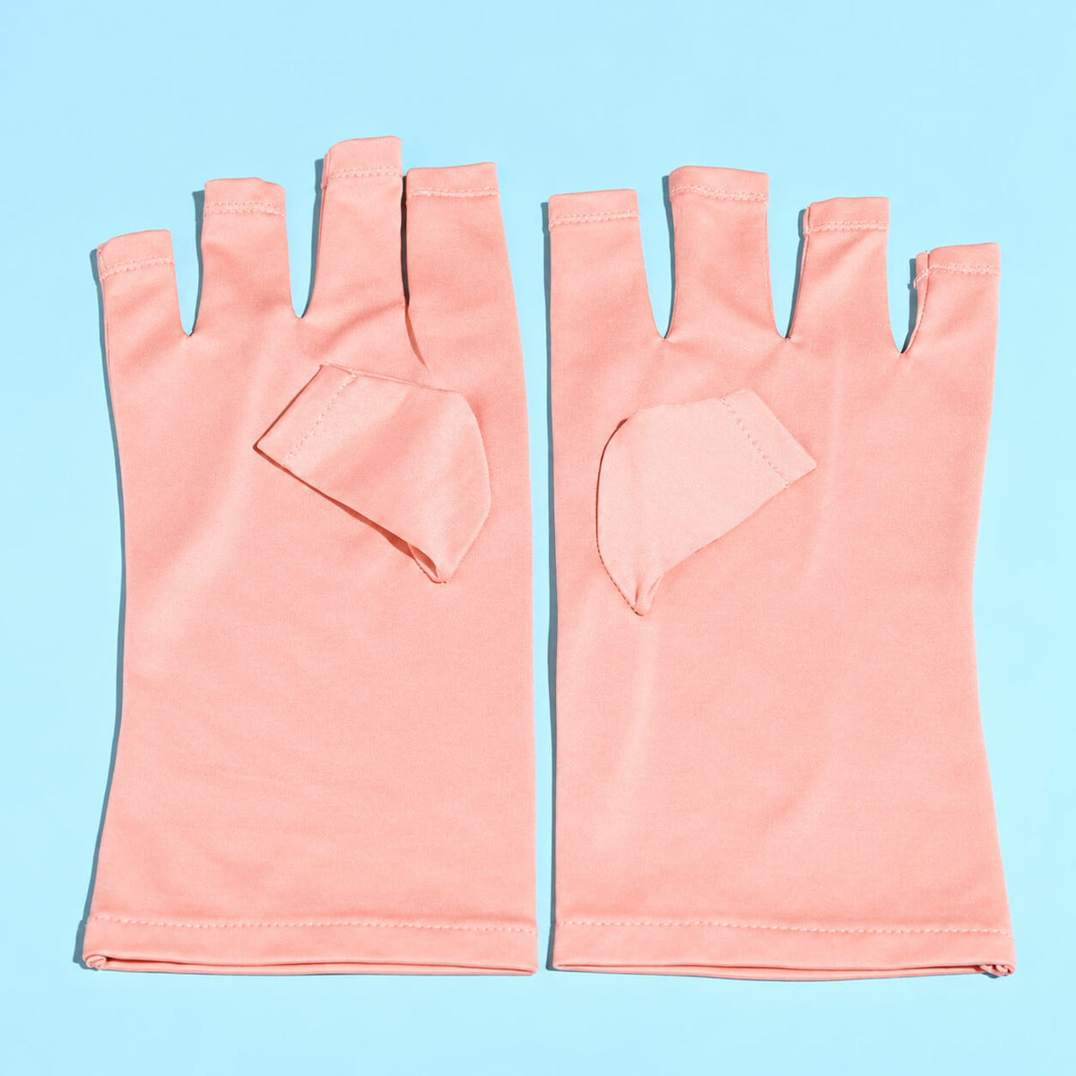Pink nail gloves for gel polish curing under UV LED lamp