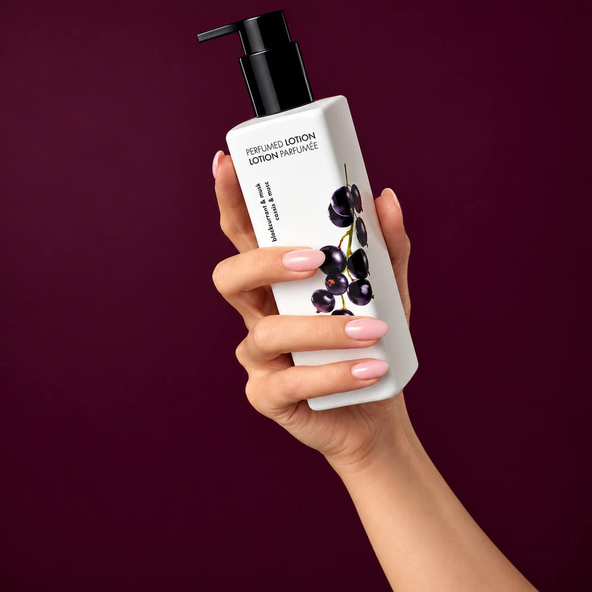 White 250 ml bottle of fruity-floral scented hand and body lotion