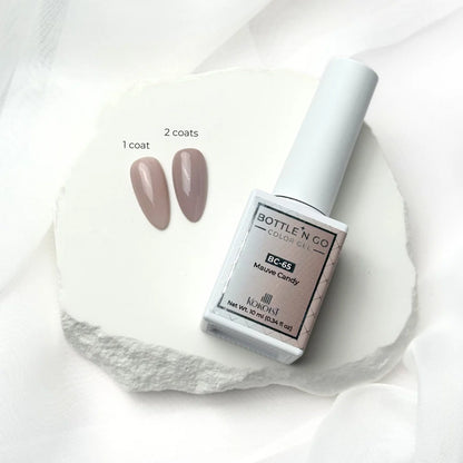 10ml — Kokoist Bottle 'N Go BC-65 Mauve Candy — swatch on nail tip, translucent mauve finish